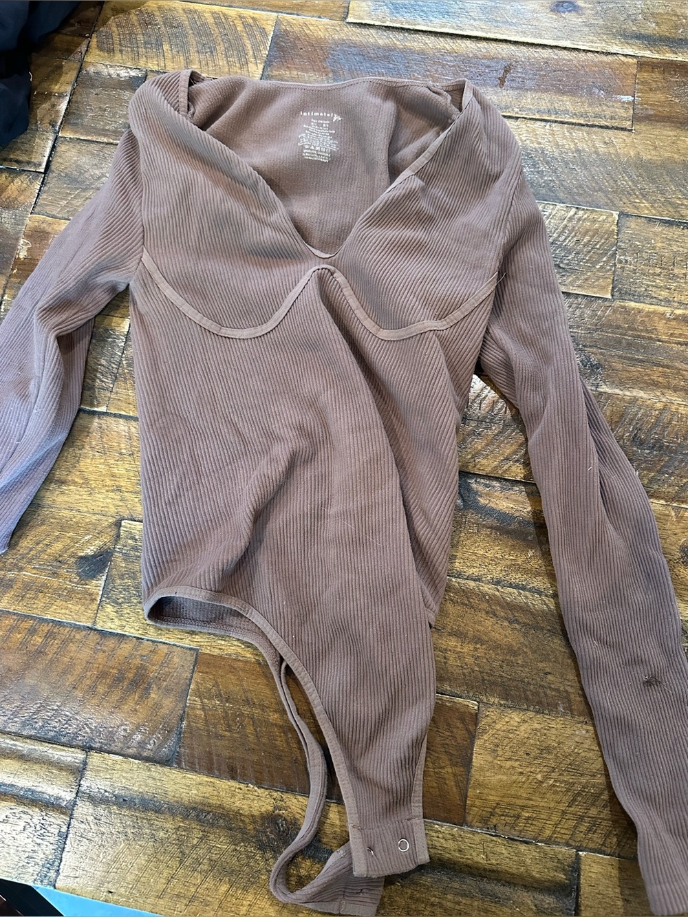 Free People Ribbed Long-Sleeve Bodysuit in Brown missing one button